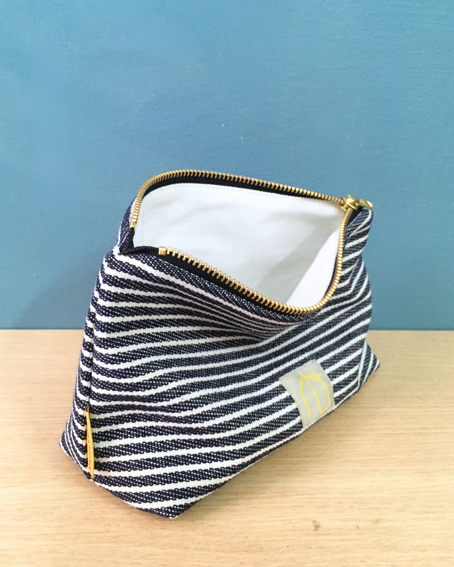 Pochette GIO mare blu a righe bianche